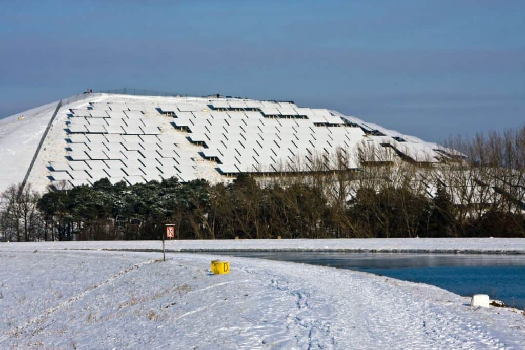 Lots of solar panels with snow