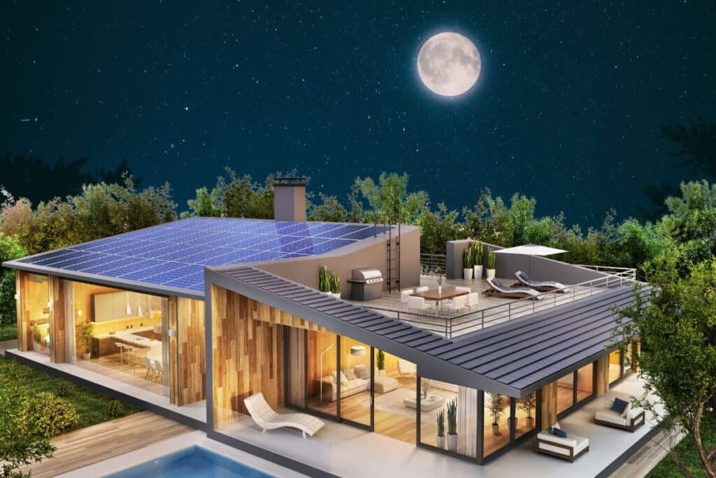 Solar panels on a house roof under the moonlight