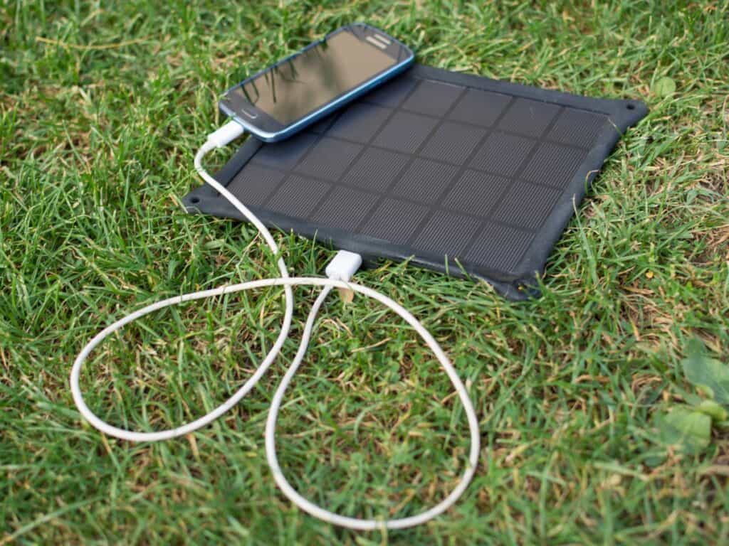 Solar panel charging a cell phone